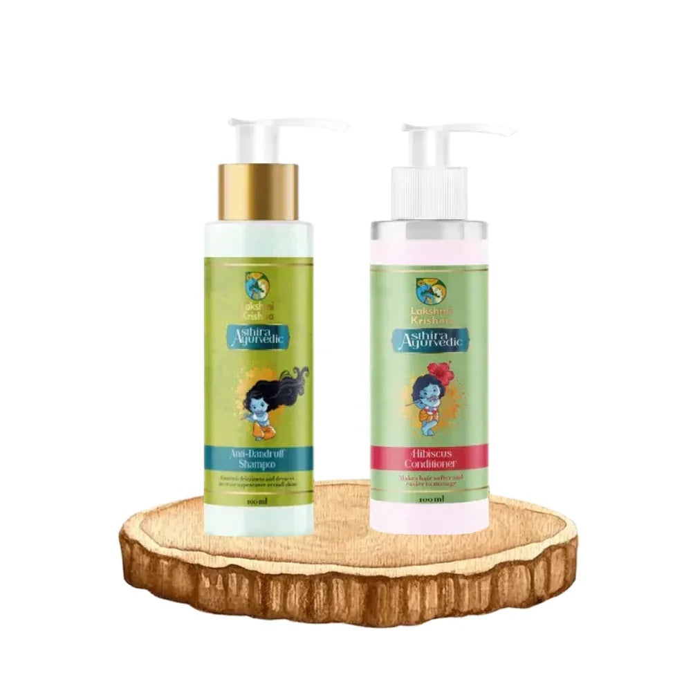 Anti-Dandruff Shampoo and Hibiscus Conditioner bottles by Lakshmi Krishna on wooden platform