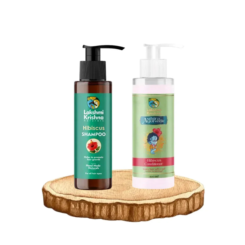 Lakshmi Krishna Hibiscus Shampoo and Conditioner bottles on wooden platform for hair care