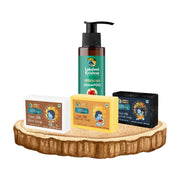 Lakshmi Krishna Naturals Hibiscus shampoo with Ashira Ayurvedic goat milk rice, saffron, and charcoal soaps on wooden tray